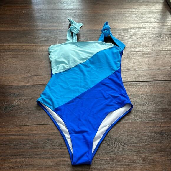 Other - Color block NWOT Swimming Suit, full coverage, padded bra and high back.